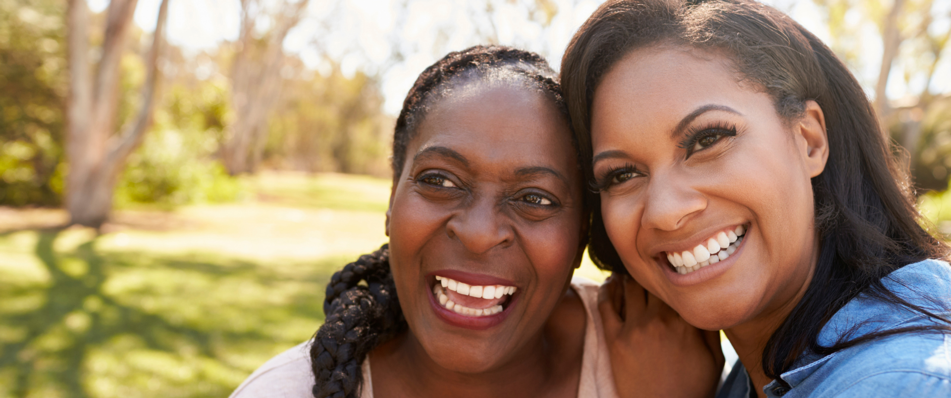 Two people smiling at park