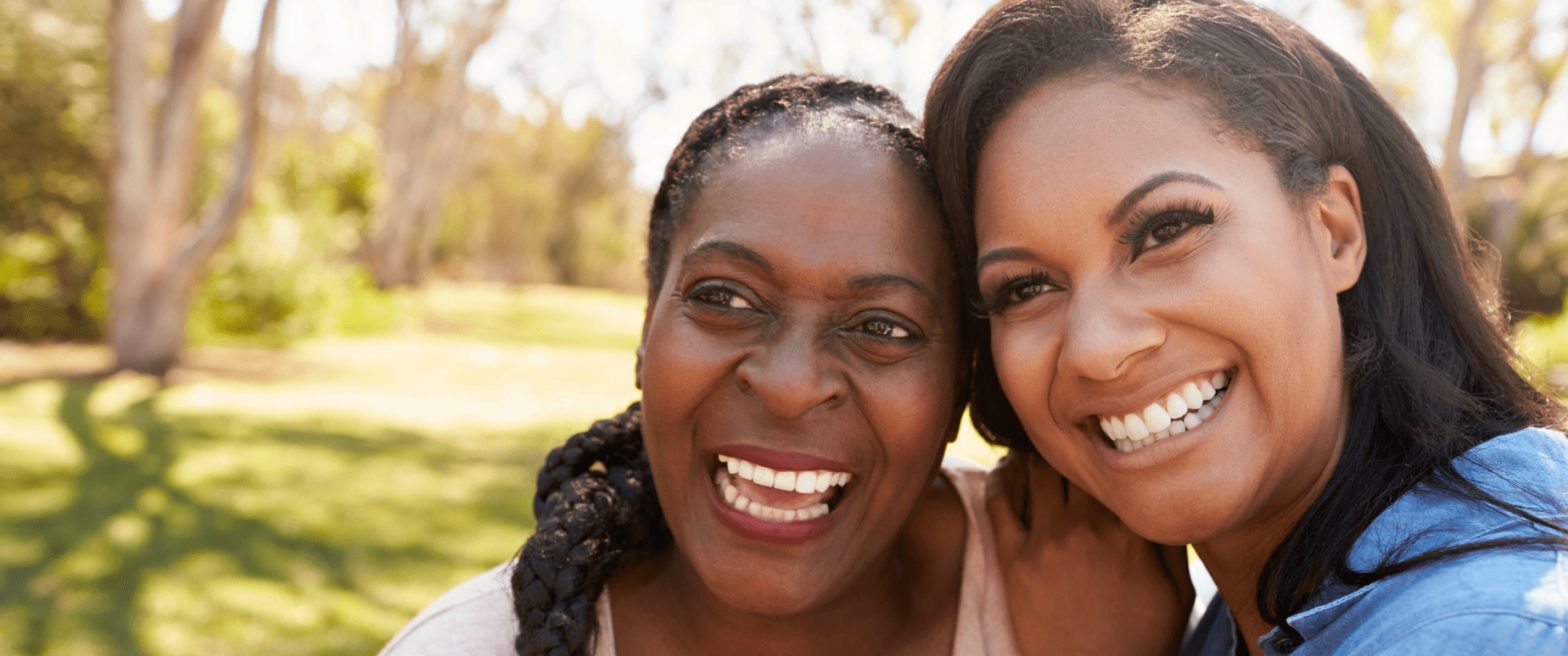 Two people smiling at park