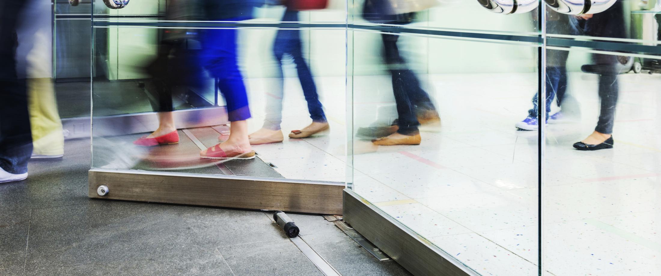 People walking through a door.