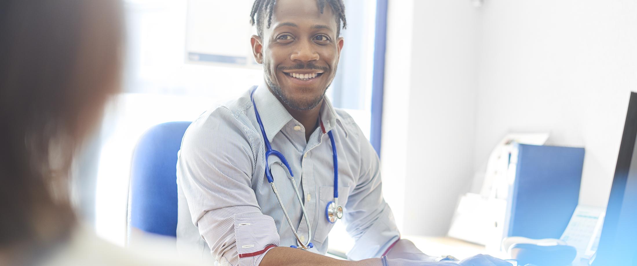 Happy provider talking with another provider.