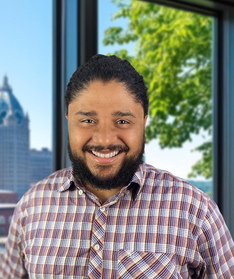 A headshot of Christian Ribeiro