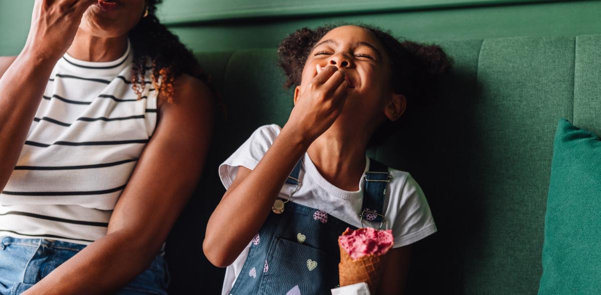 Mom and daughter enjoying ice cream.