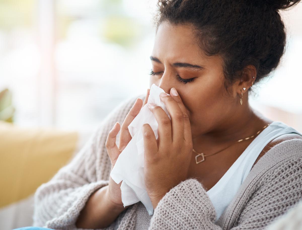 Person blowing their nose.