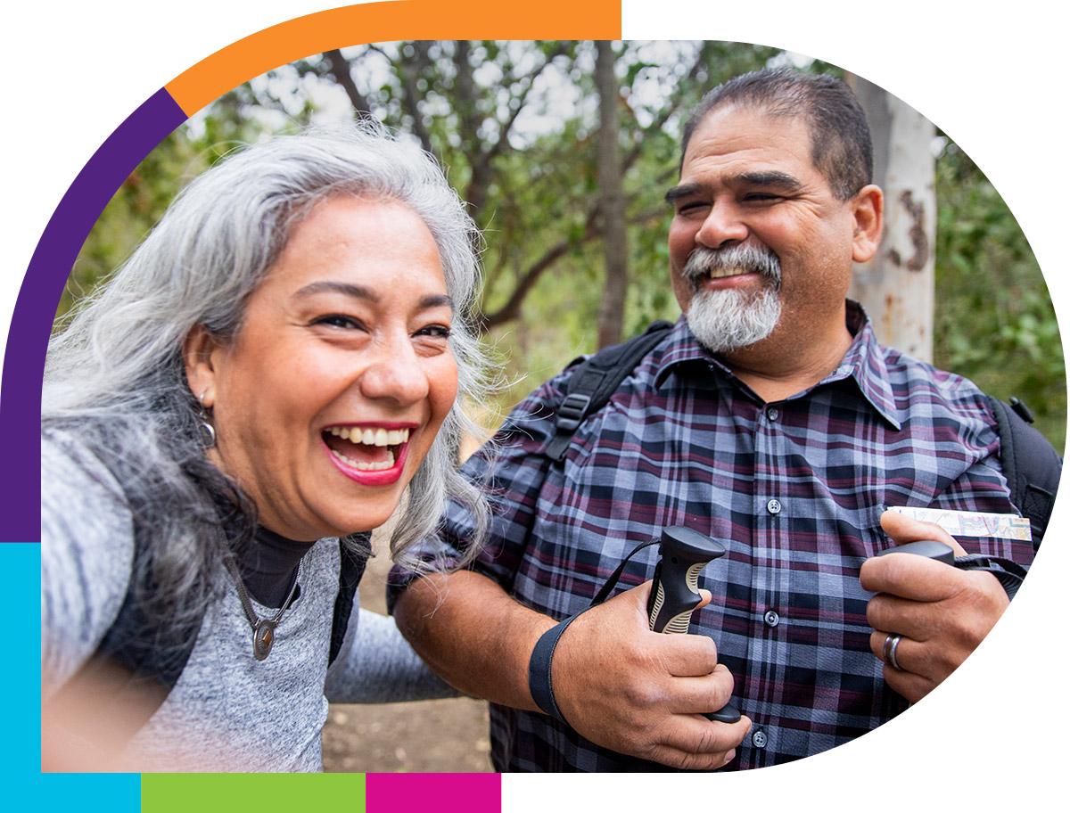 Happy and energetic older couple walking outdoors