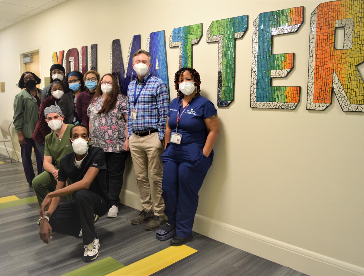 Dental team posing with the You Matter sign.