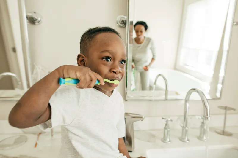 Toddler brushing teeth.