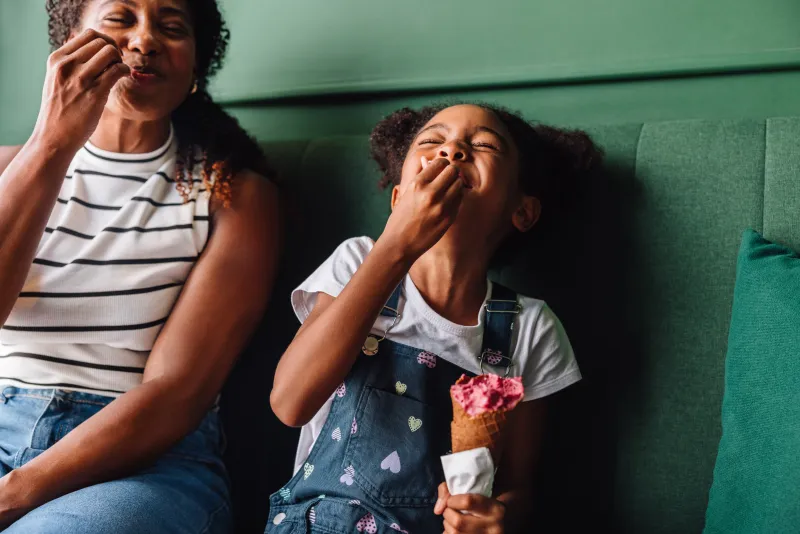 Mom and daughter enjoying ice cream.