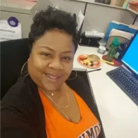 Tonya Williamson sitting at her desk